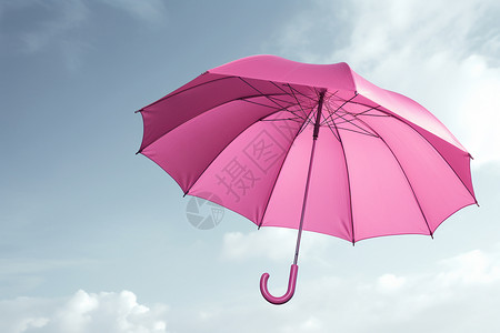 粉红色雨伞在天空上设计图片