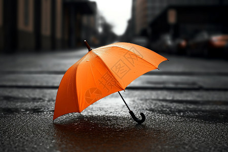 在橙色明亮的橙色雨伞放置在潮湿的路面上背景