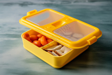 黄色塑料多格餐盒背景图片