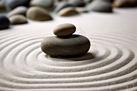 佛教经幡沙子上的鹅卵石设计图片