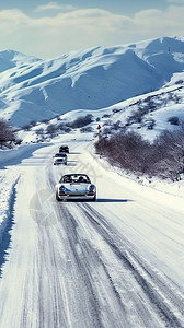 行驶在雪山蜿蜒的道路上的车背景图片