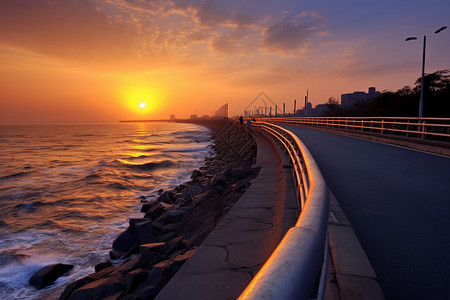 马路栏杆日落下的海浪背景