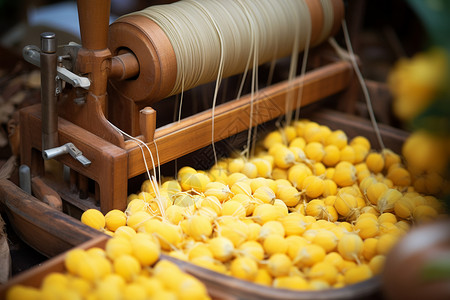 传统蚕丝纺织工具背景图片