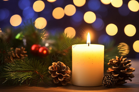 圣诞节松果旁的蜡烛高清图片
