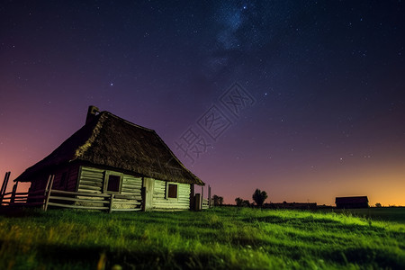 乡村夜夜空下的小房子背景