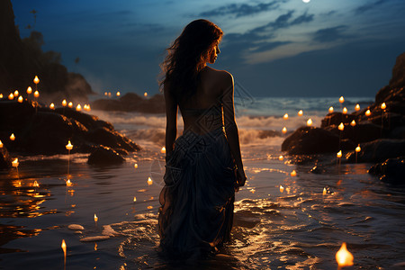 月色下美丽的女生走在海浪里图片