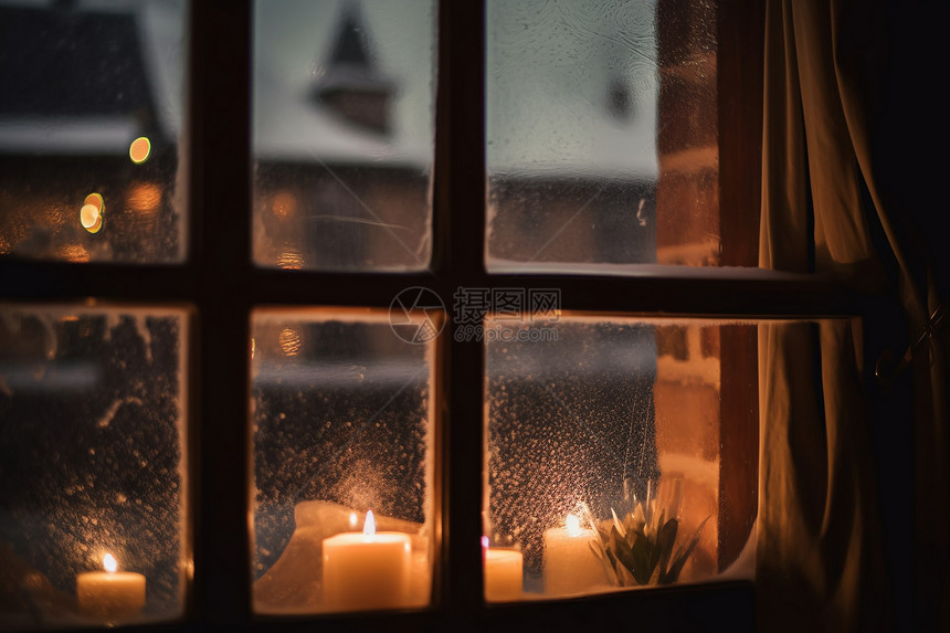 窗边燃烧的蜡烛图片