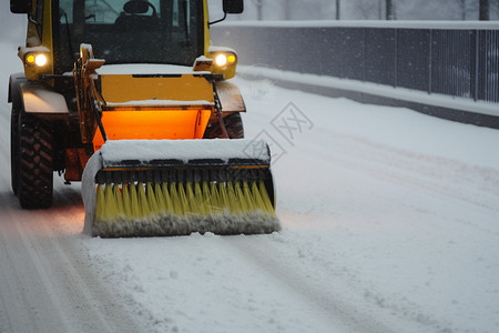 大雪路上冬季路上的扫雪车背景