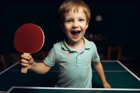 手拿乒乓球拍的小男孩背景图片