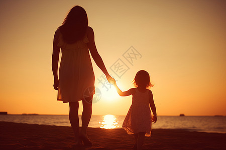 海滩母女日落时海滩上的母女背景