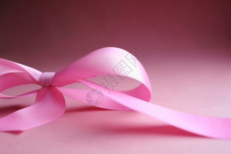 心形和动感飘带粉色打结的丝带背景