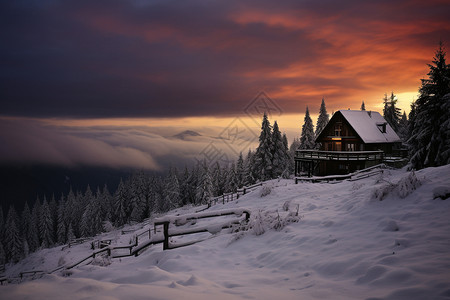 大雪后山顶的木屋图片
