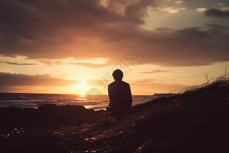 海边欣赏日落的男子背景图片