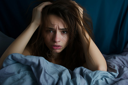 床上失眠焦虑的女子背景图片