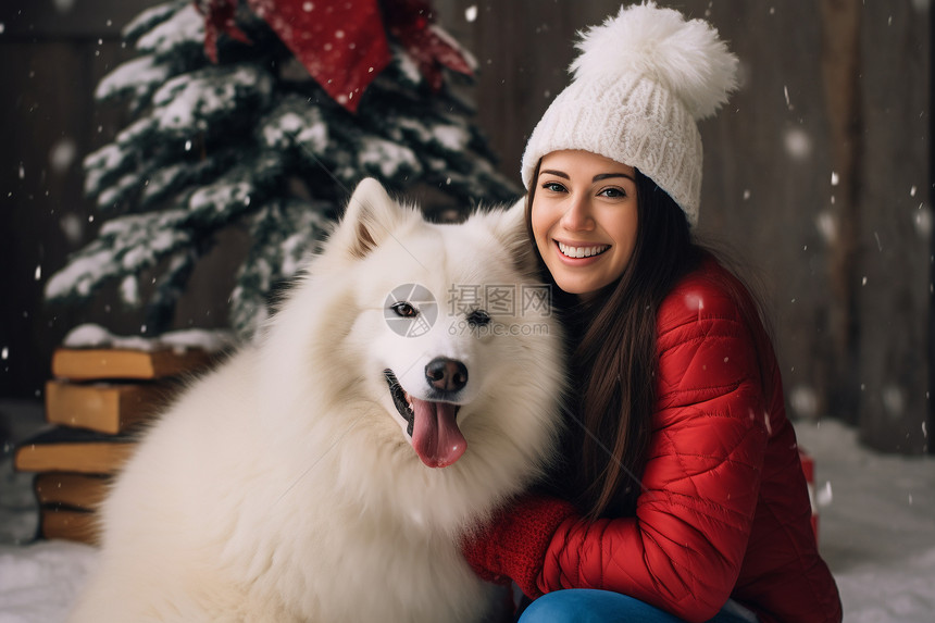冬天雪地中的女子和狗狗图片