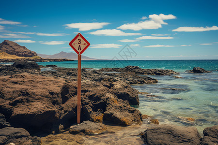 沙滩上的危险提示牌背景图片