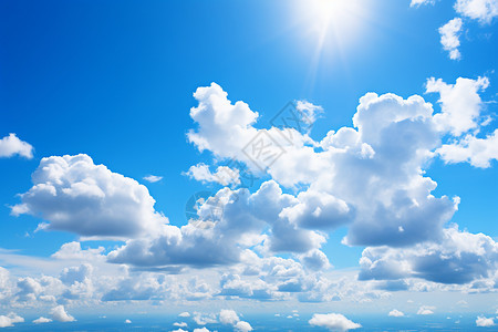 夏日晴空中的白云与蓝天背景图片