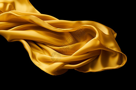丝绸飘动金黄色的丝带飘动在黑色背景下设计图片