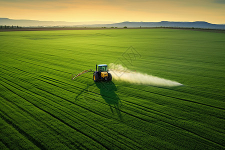 车子在田地喷洒农药背景图片