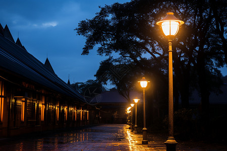 古巷夜景静谧的古巷点亮的路灯背景