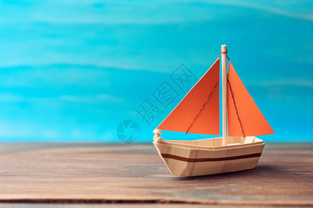 可爱的折纸小船木桌上的小纸船背景