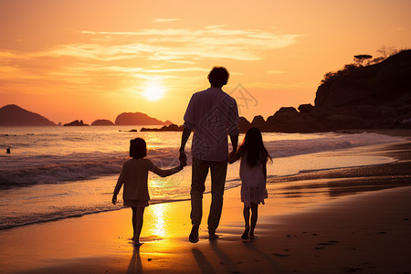 一对父母牵着孩子在海滩上漫步背景图片