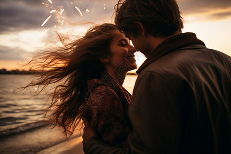 海滩上甜蜜亲吻的年轻情侣背景图片