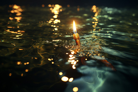 水中飘浮的蜡烛高清图片