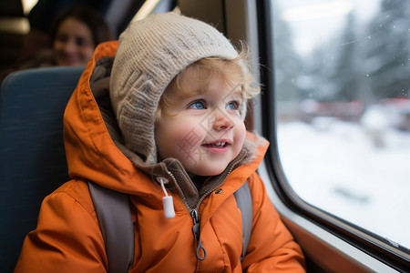 火车上眺望车窗外风景的孩子高清图片