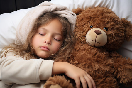 安睡中的小女孩与玩具熊图片