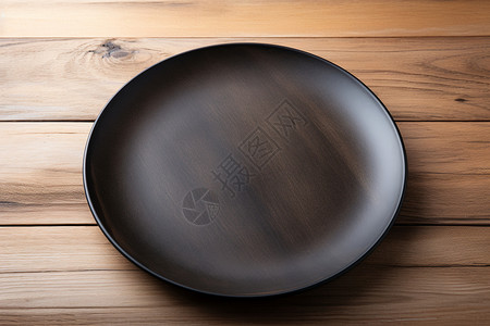 黑色餐具极简主义的黑色木质餐盘背景