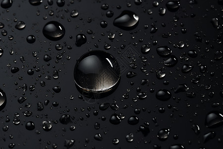 滴落的水珠湿润的黑色表面设计图片