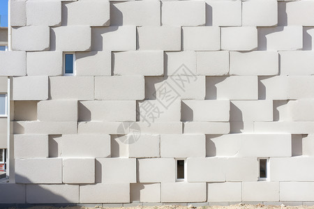 房屋建筑的白瓦砖墙背景图片