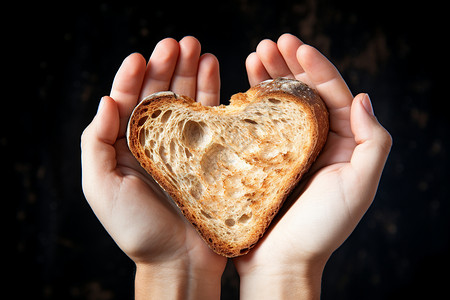 手指爱心心形面包背景