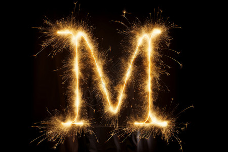 烟花字母火花中的字母M背景
