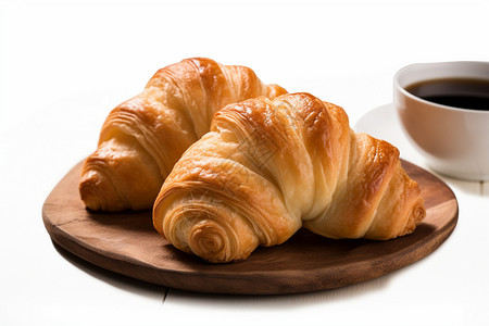 烘培面包设计饮品木盘上的面包和杯中的咖啡背景