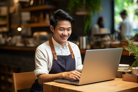 咖啡店的咖啡师用电脑图片