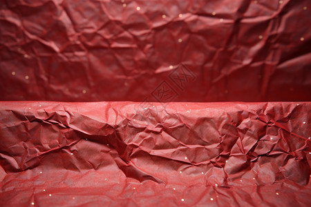 红色纸制上的褶皱背景图片