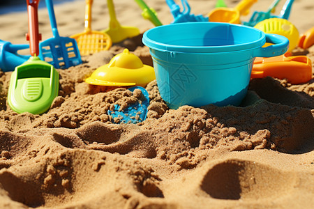 沙坑沙滩上的玩具背景