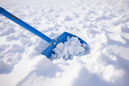 雪地中的铲子背景图片