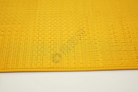 一张黄色的餐桌垫背景图片