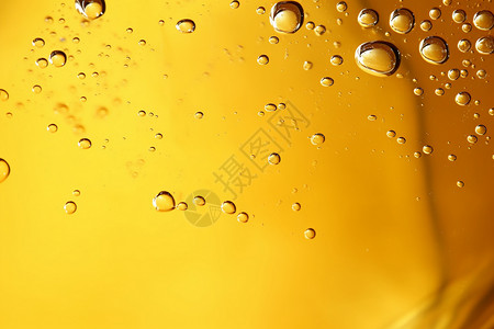 黄色液体水滴背景背景图片