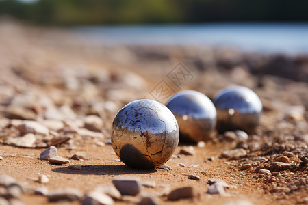 铁球撞击湖边上有三颗金属珠子背景
