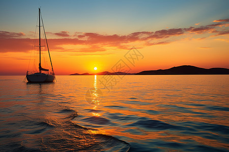 夕阳下的海洋帆船图片