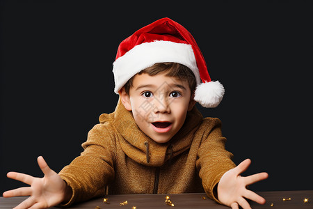 一个戴着圣诞帽的小男孩背景图片
