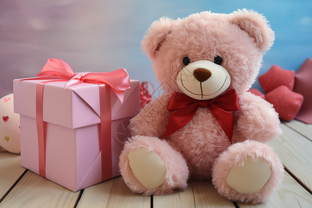 粉红熊坐在粉色礼盒旁边的玩具熊背景