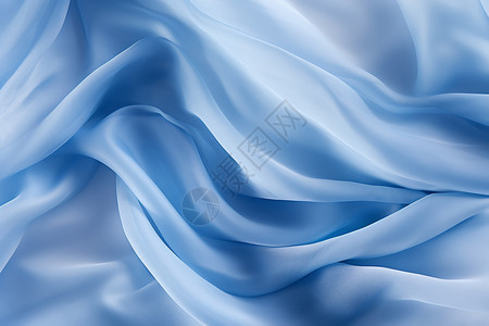 蓝色的风风中飘扬的蓝色丝绸背景