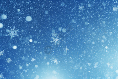 天空中的雪蓝色背景上的雪花设计图片