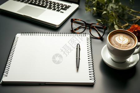 桌面上的本子和咖啡背景图片