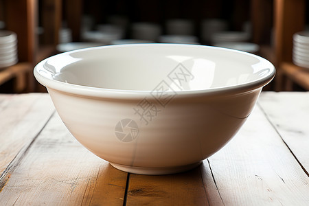 木桌上的白瓷碗背景图片